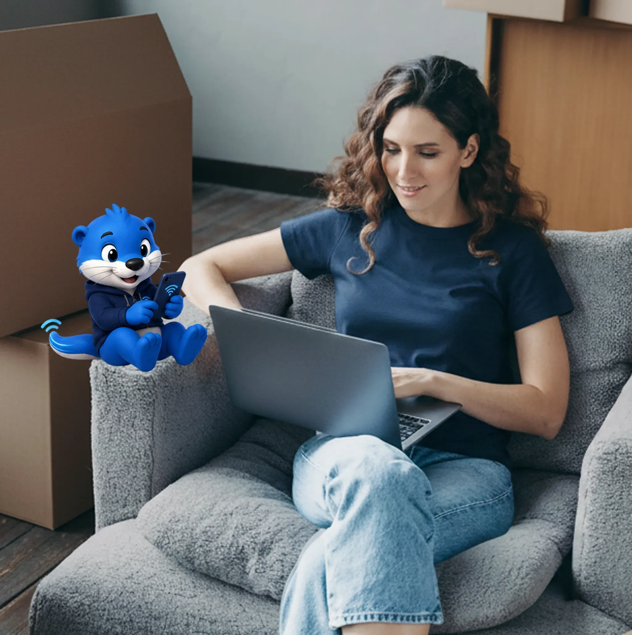 A person working on a laptop at home, surrounded by moving boxes